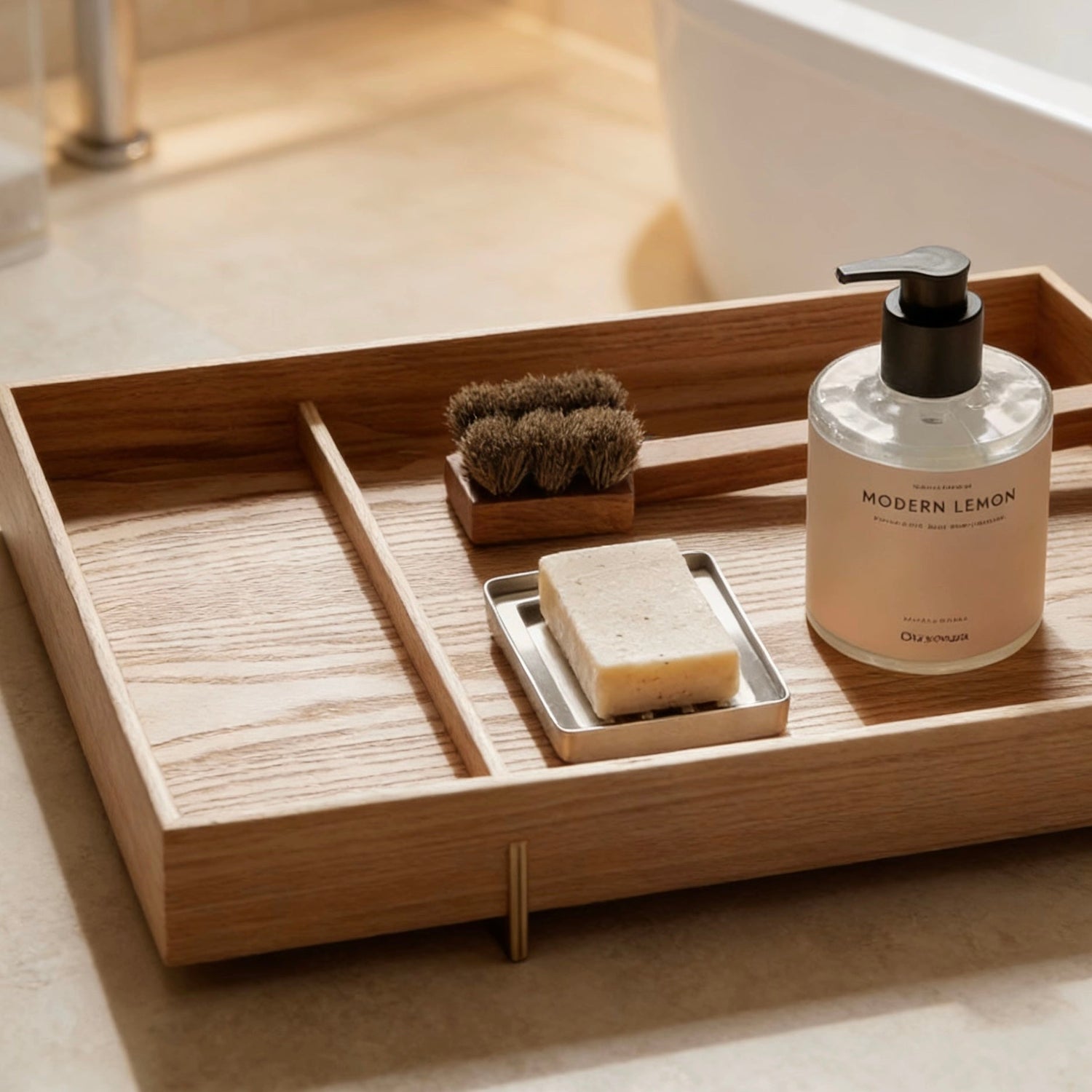 Minimalist bath and spa collection featuring a wooden bathroom tray with soap dispenser, brush, and candle next to a white bathtub in a sunlit bathroom.